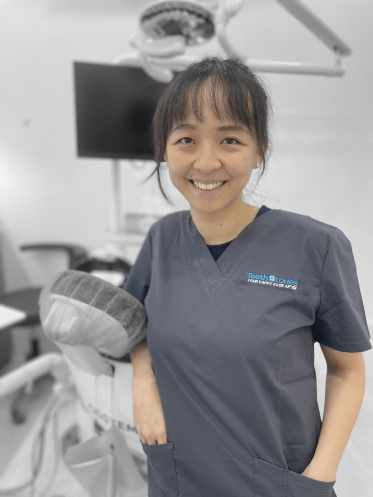 Smiling dental nurse in clinic.