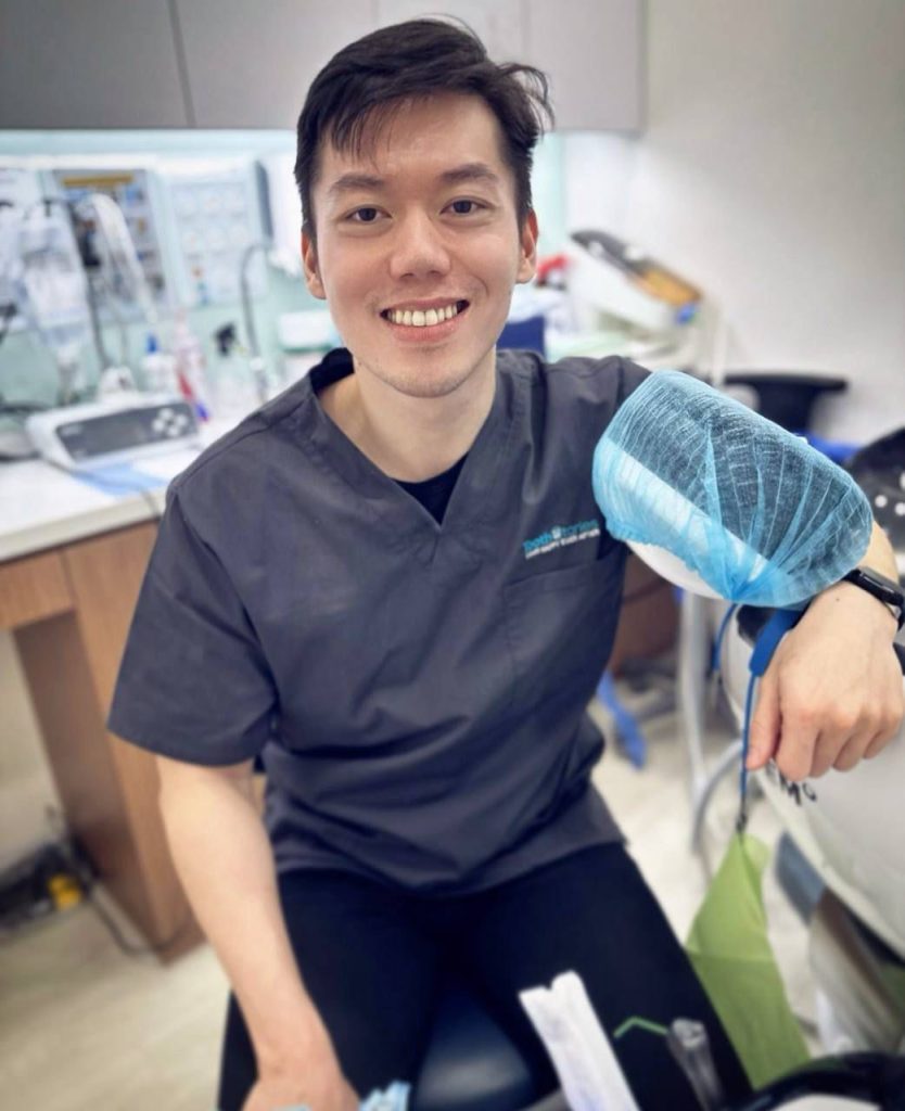 dentist smiling in uniform